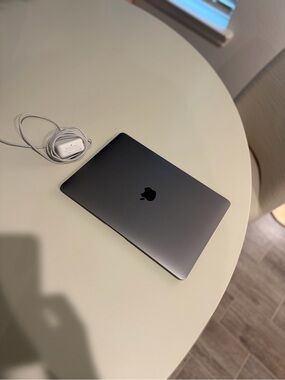 Apple MacBook in Space Gray with White Charger